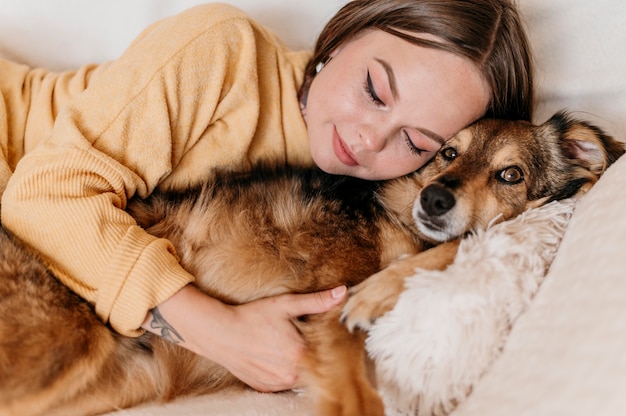 Woman petting adorable dog