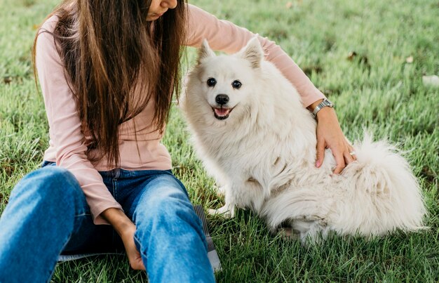 Woman petting adorable dog