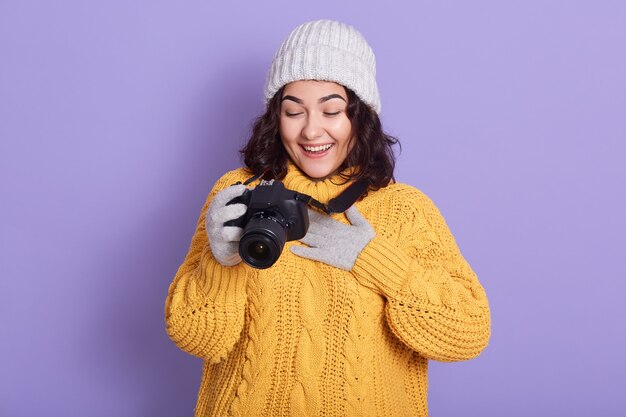 Woman photographer takes images with camera