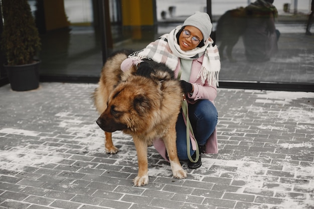 Woman in a pink coat with dogs