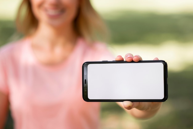 Woman in pink t-shirt and copy space horizontal mobile phone