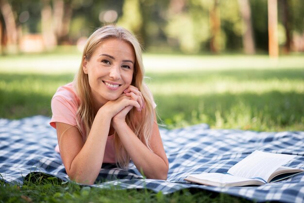 Woman in pink t-shirt smiles front view