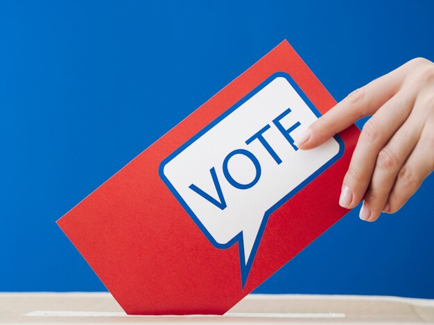 Woman placing her ballot in the election box