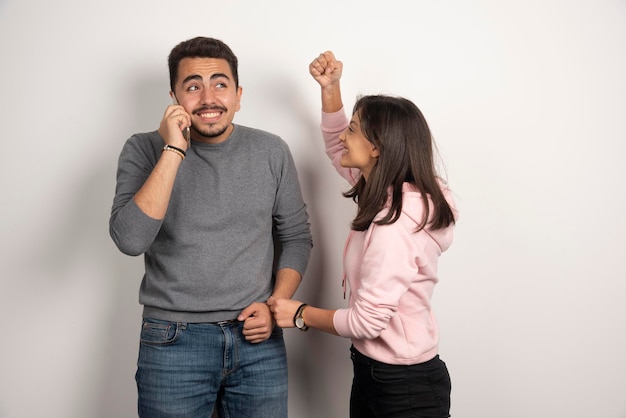 Woman playfully fighting with her boyfriend.