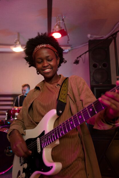 Woman playing the guitar at a local event