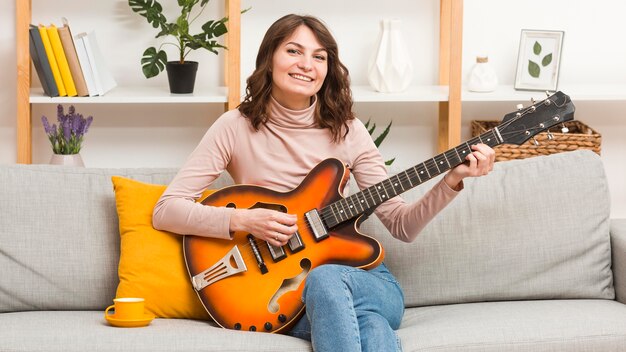 Woman playing guitar