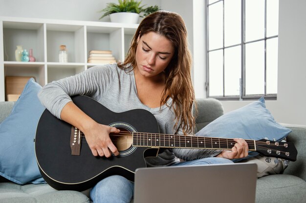 Woman playing guitar