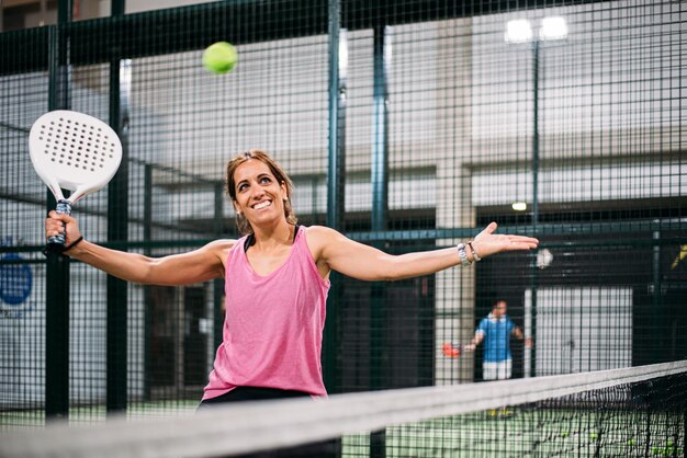 Woman playing padel