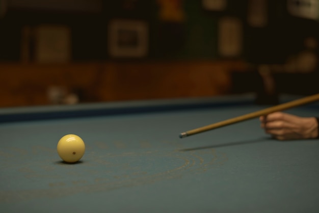 Woman playing pool at a bar