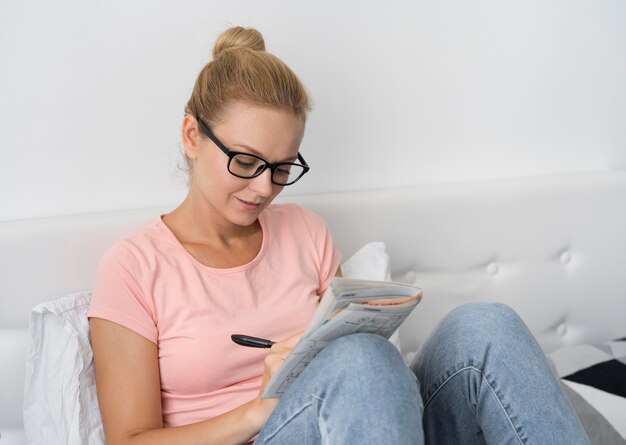 Woman playing a sudoku game alone