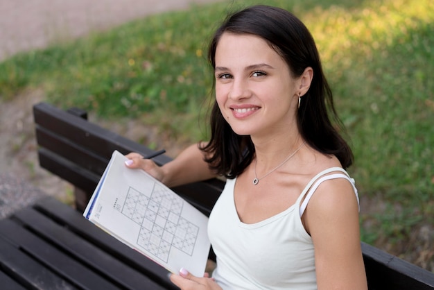 Free photo woman playing a sudoku game