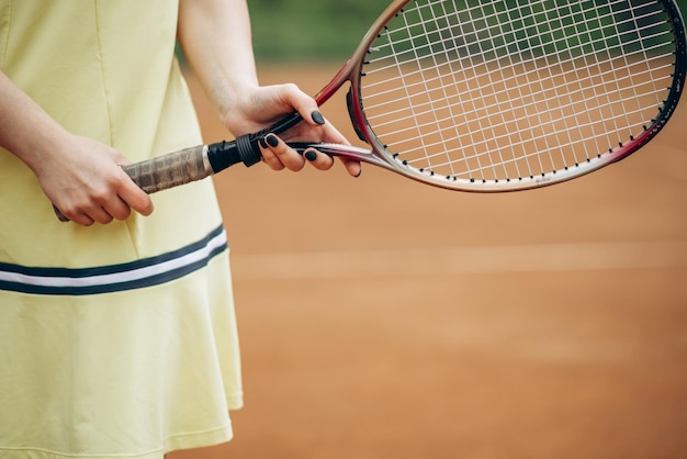 Woman playing tennis at the court