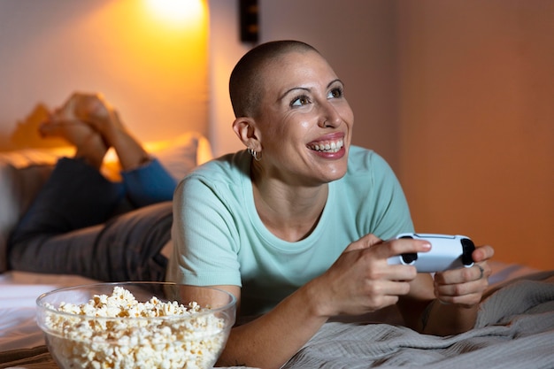 Woman playing a video game with her console