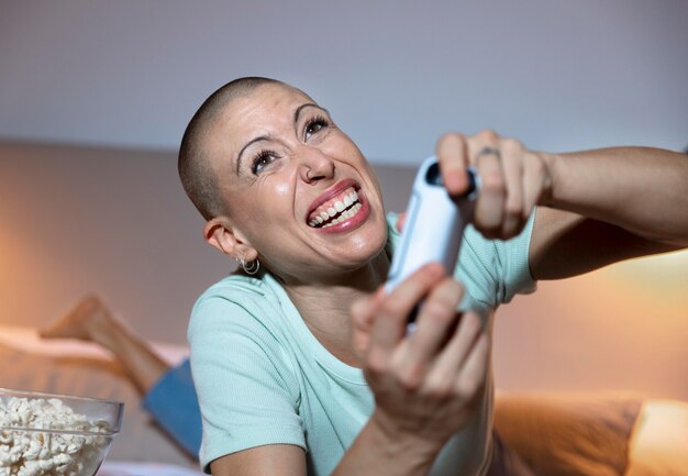 Woman playing a video game with her console