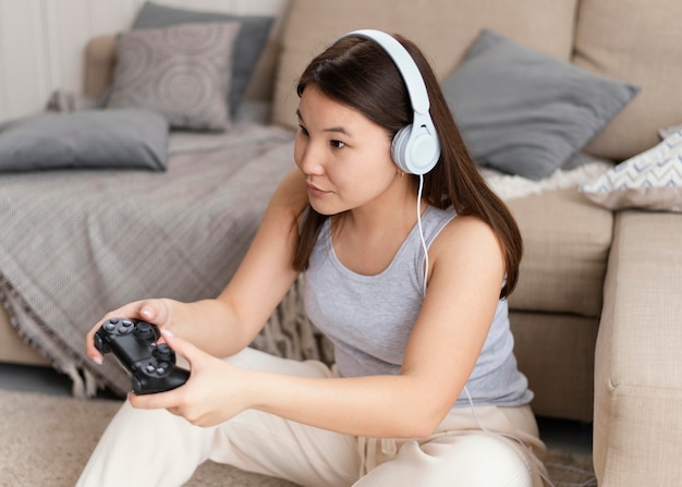 Woman playing videogame with controller