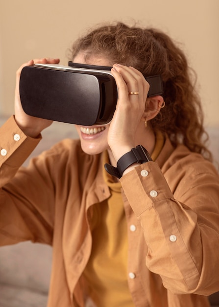 Free photo woman playing on virtual reality headset