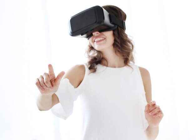 Woman playing to Virtual reality