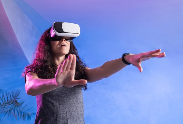 Woman playing on vr set in a modern room