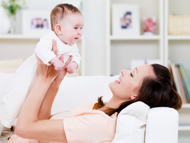 Woman playing with baby