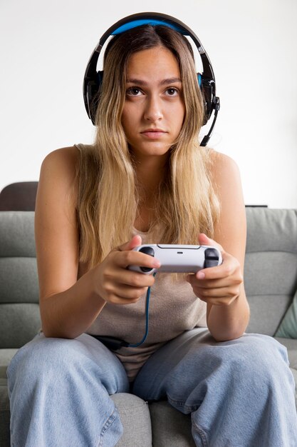 Woman playing with controller medium shot