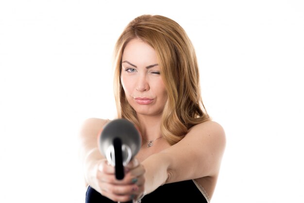 Woman pointing a dryer