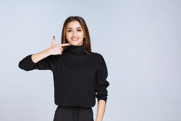 woman pointing at her aesthetic chin filling. 