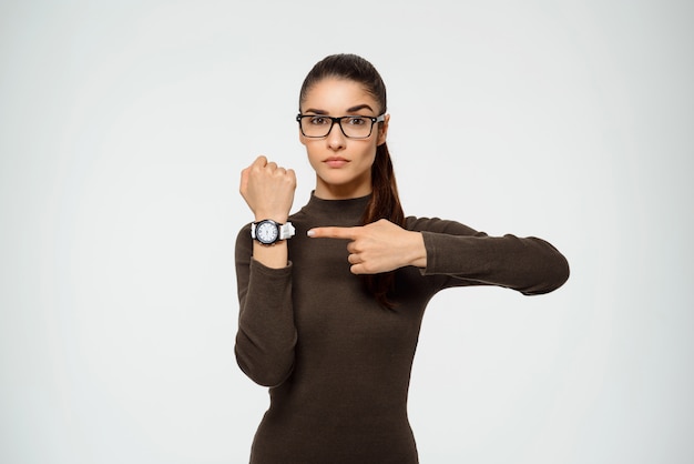 woman pointing watch, time is running out
