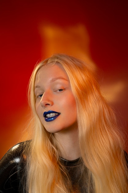 Free photo woman portrait with bright blue lips