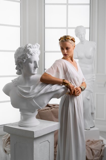 Woman posing as greek goddess side view