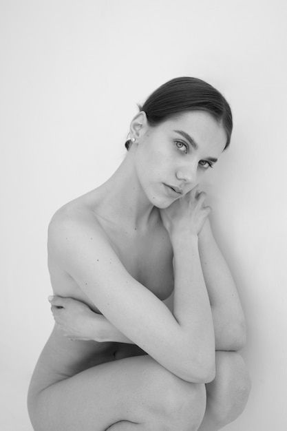 Woman posing black and white nudity high angle