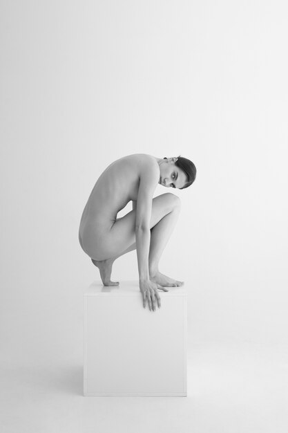 Woman posing black and white nudity side view
