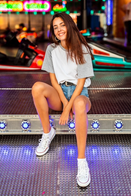 Woman posing at bumper cars