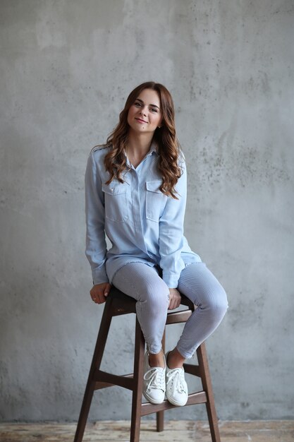 Woman posing on chair