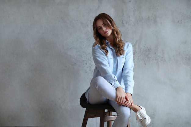 Woman posing on chair