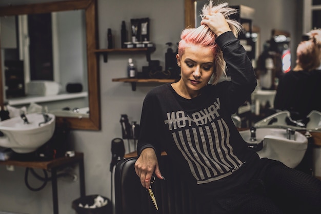 Woman posing in hairdressing salon