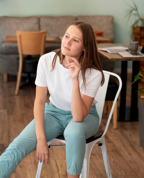 Free photo woman posing at home during the pandemic