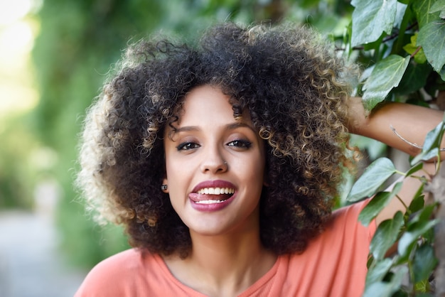 Woman posing leaning on a creeper plant