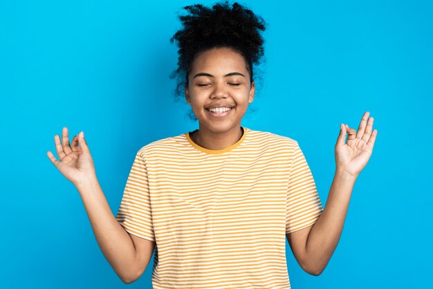 Woman posing and making zen sign