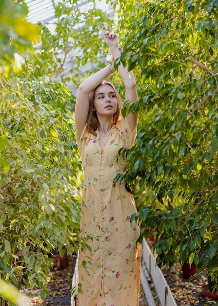 Woman posing in the middle of foliage