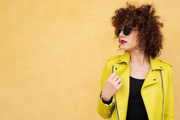 Woman posing on plain background