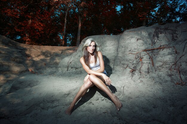 Woman posing on the rocks