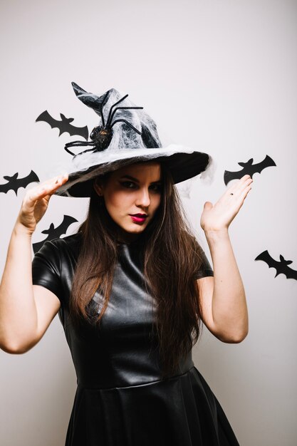 Woman posing in scary party hat