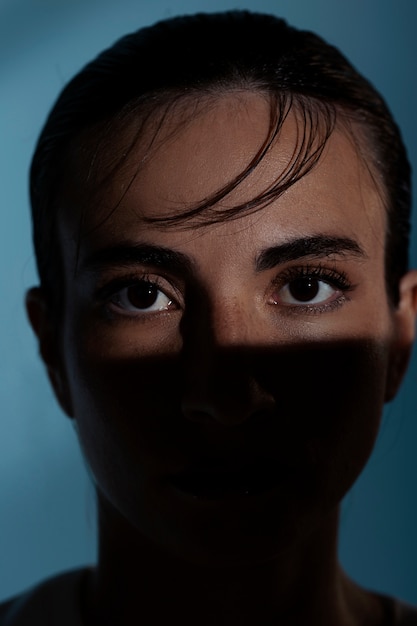 Woman posing in shadow front view