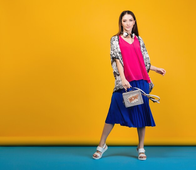 Woman posing in stylish summer fashion and bag colorful mood