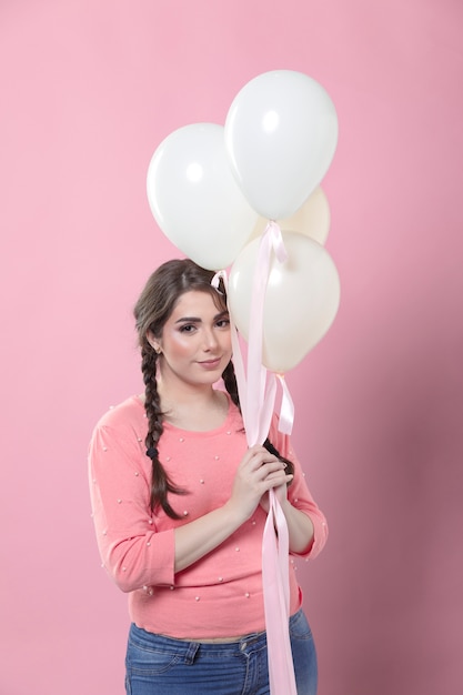 Free photo woman posing with balloons