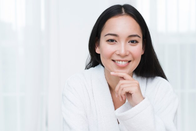 Woman posing with bathrobe in a spa