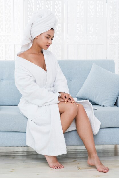 Woman posing with bathrobe in a spa