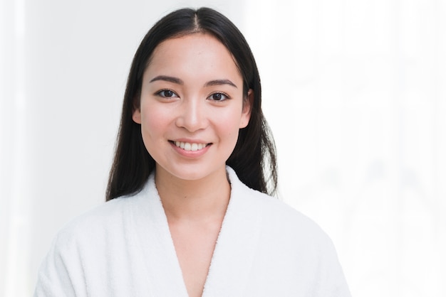 Woman posing with bathrobe in a spa