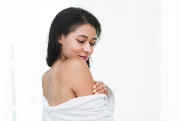 woman posing with bathrobe in a spa