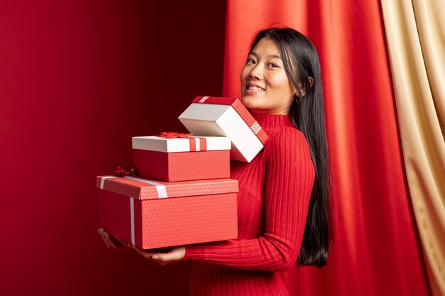 Woman posing with boxes for chinese new year